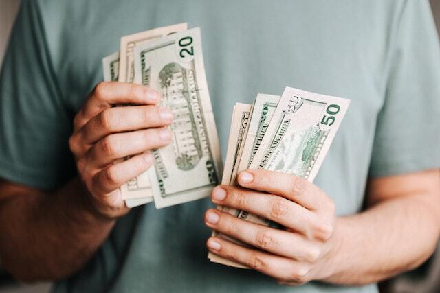 pleasanton property management company close up of hands counting money